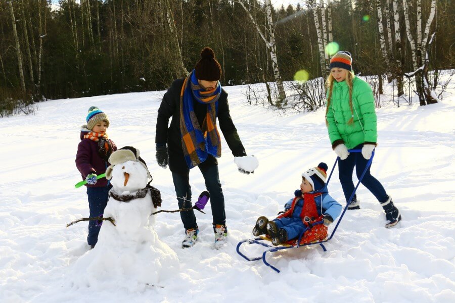 people skating on snow during winter